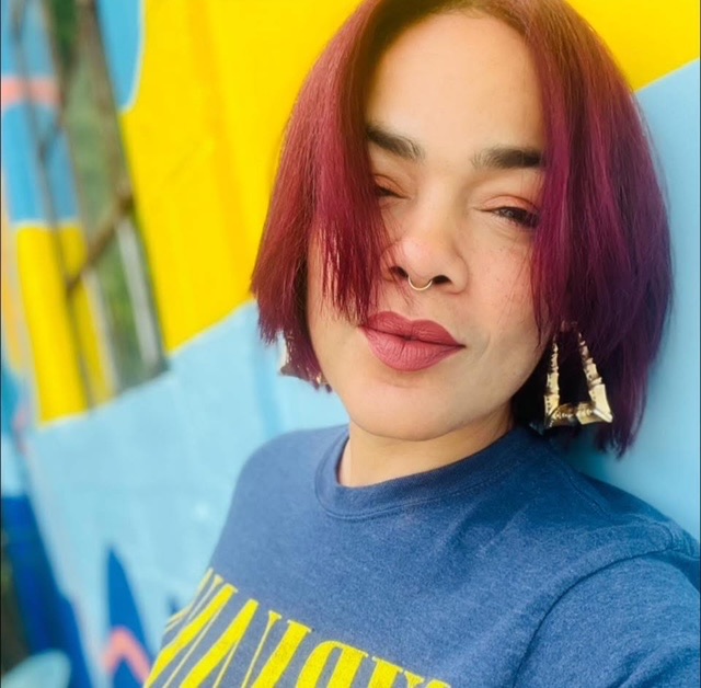 Luci, stylist at Keenan Salon in Atlanta, specializing in vivid haircolor and personalized color transformations.