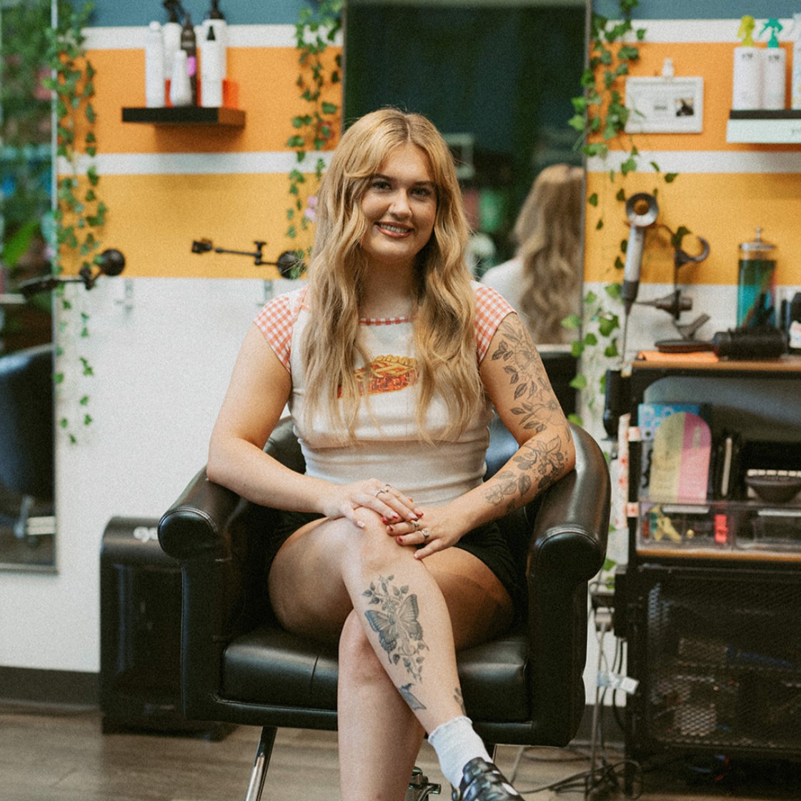 Madi, stylist at Keenan Salon in Atlanta, specializing in blonding, vivid color, and gender-affirming haircuts.