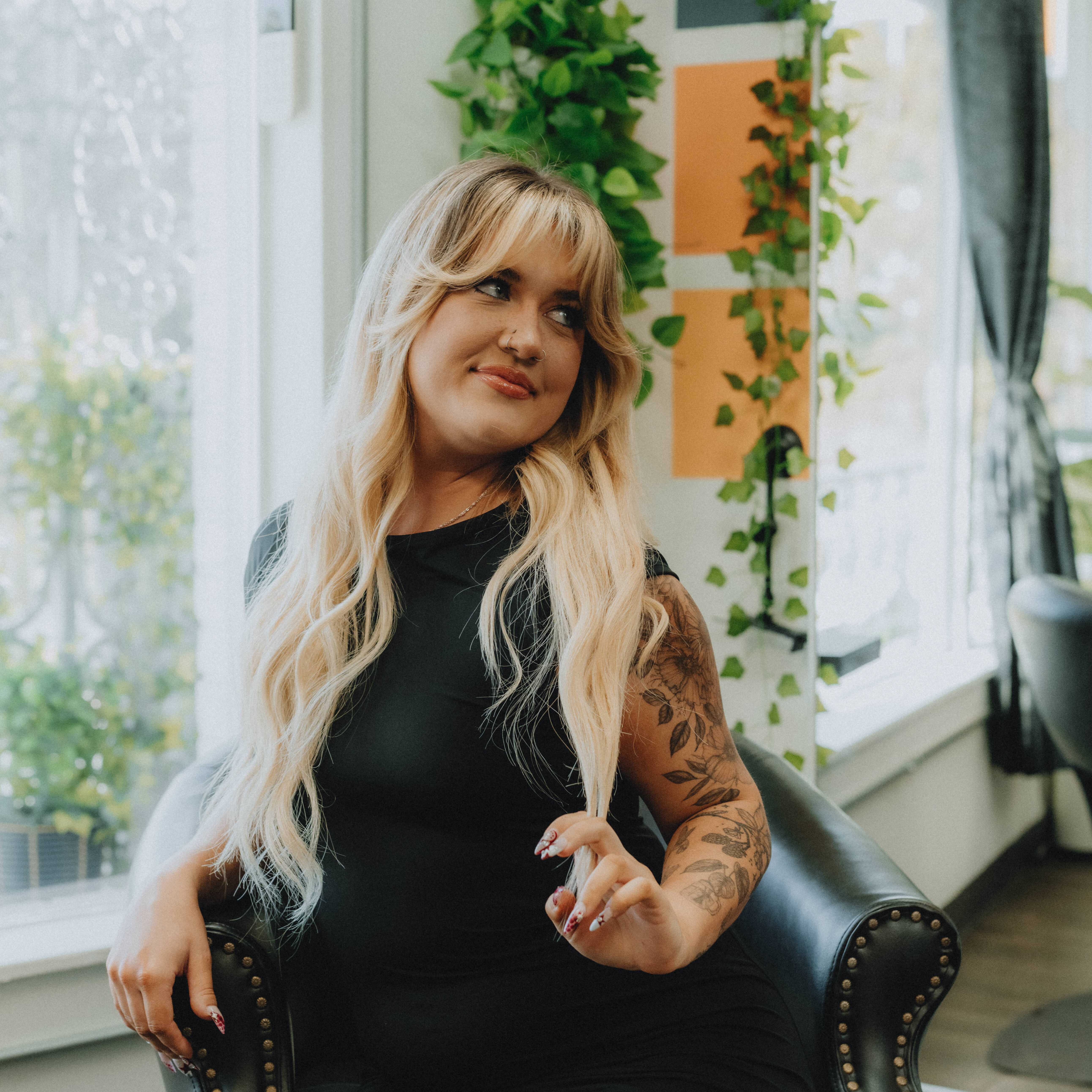 Madi, stylist at Keenan Salon in Atlanta, specializing in blonding, vivid color, and gender-affirming haircuts.