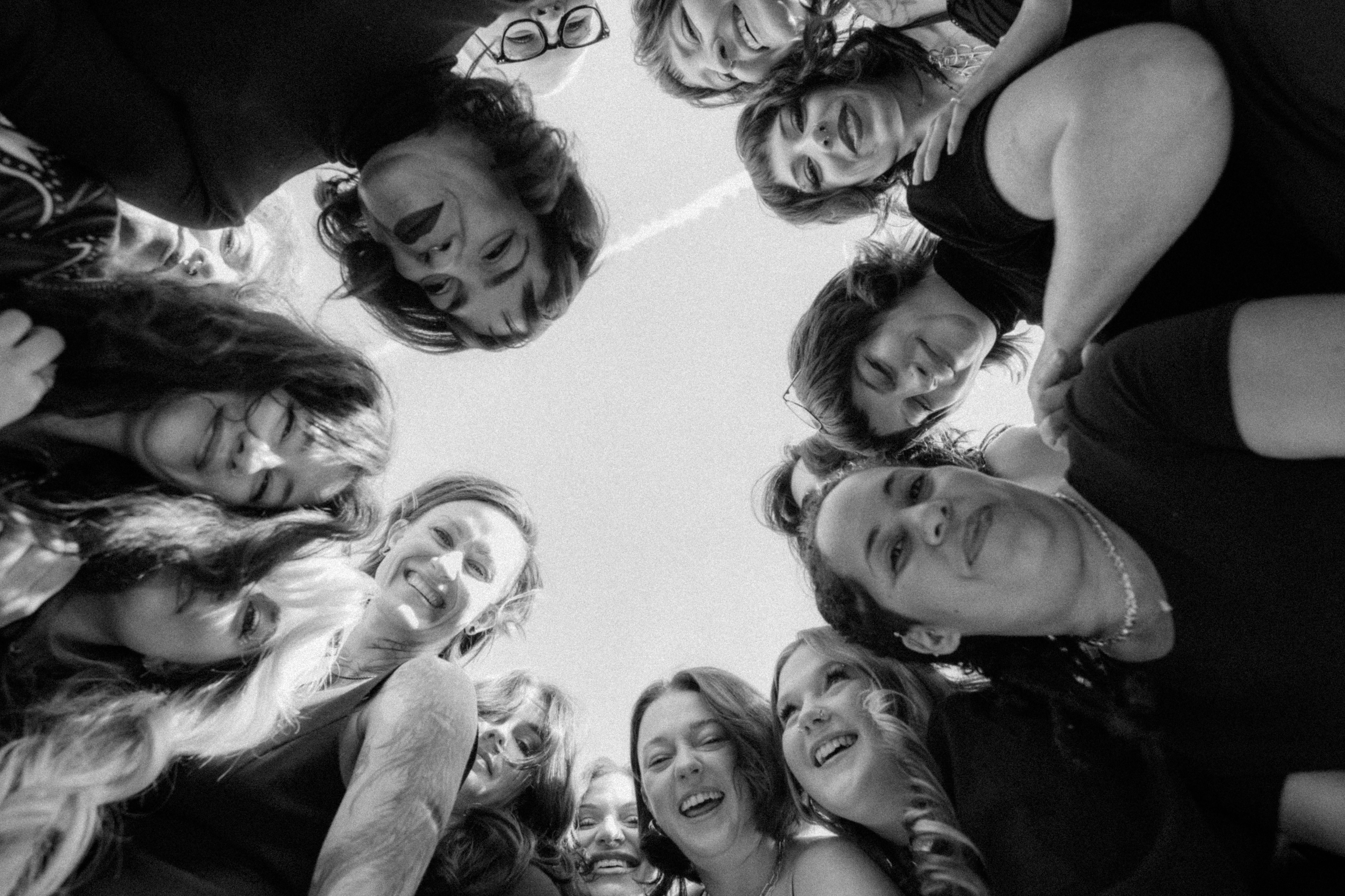 Keenan Salon team celebrating with arms raised, holding a "Best of Georgia 2024" award from Georgia Business Journal.