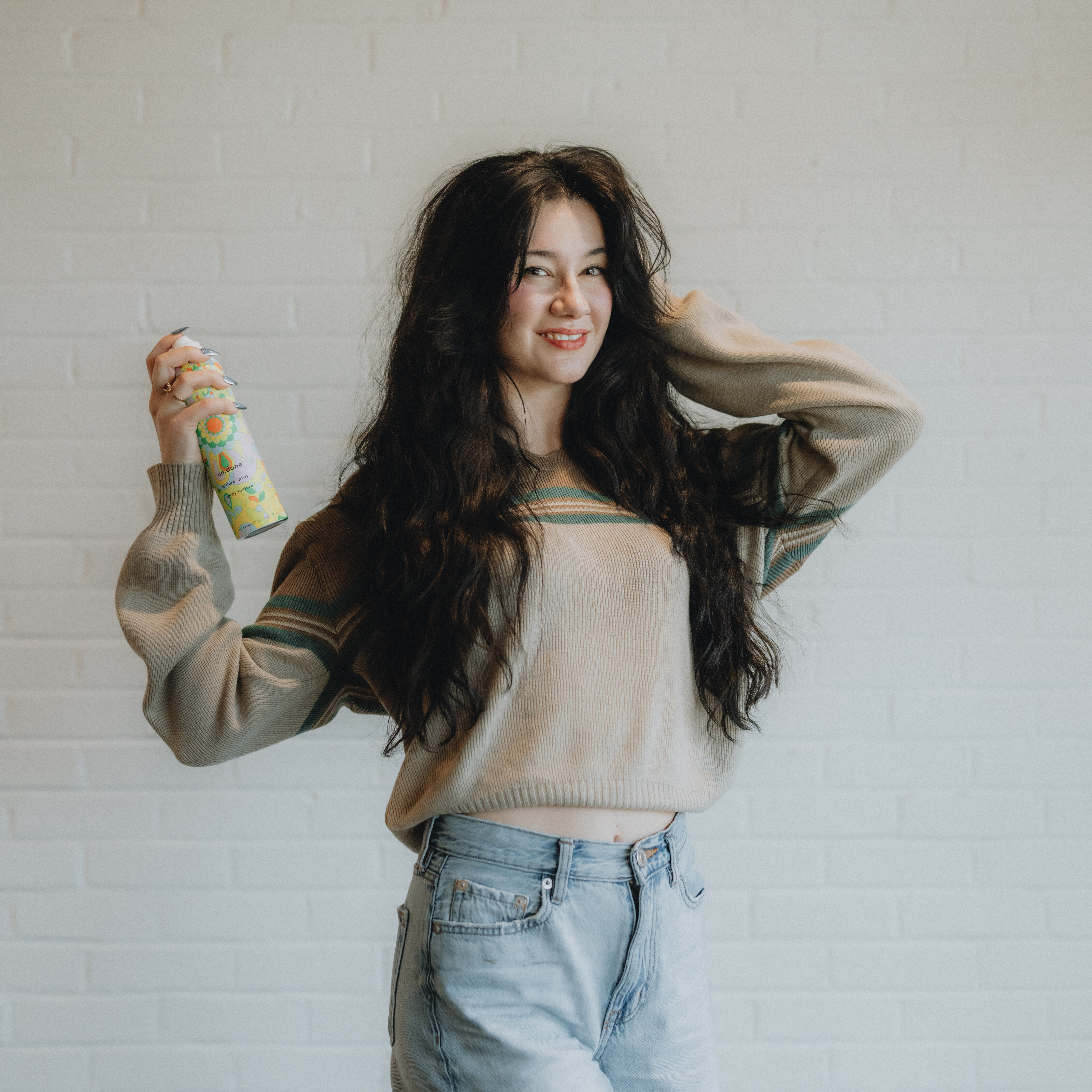 Luci, stylist at Keenan Salon in Atlanta, specializing in vivid haircolor and personalized color transformations.