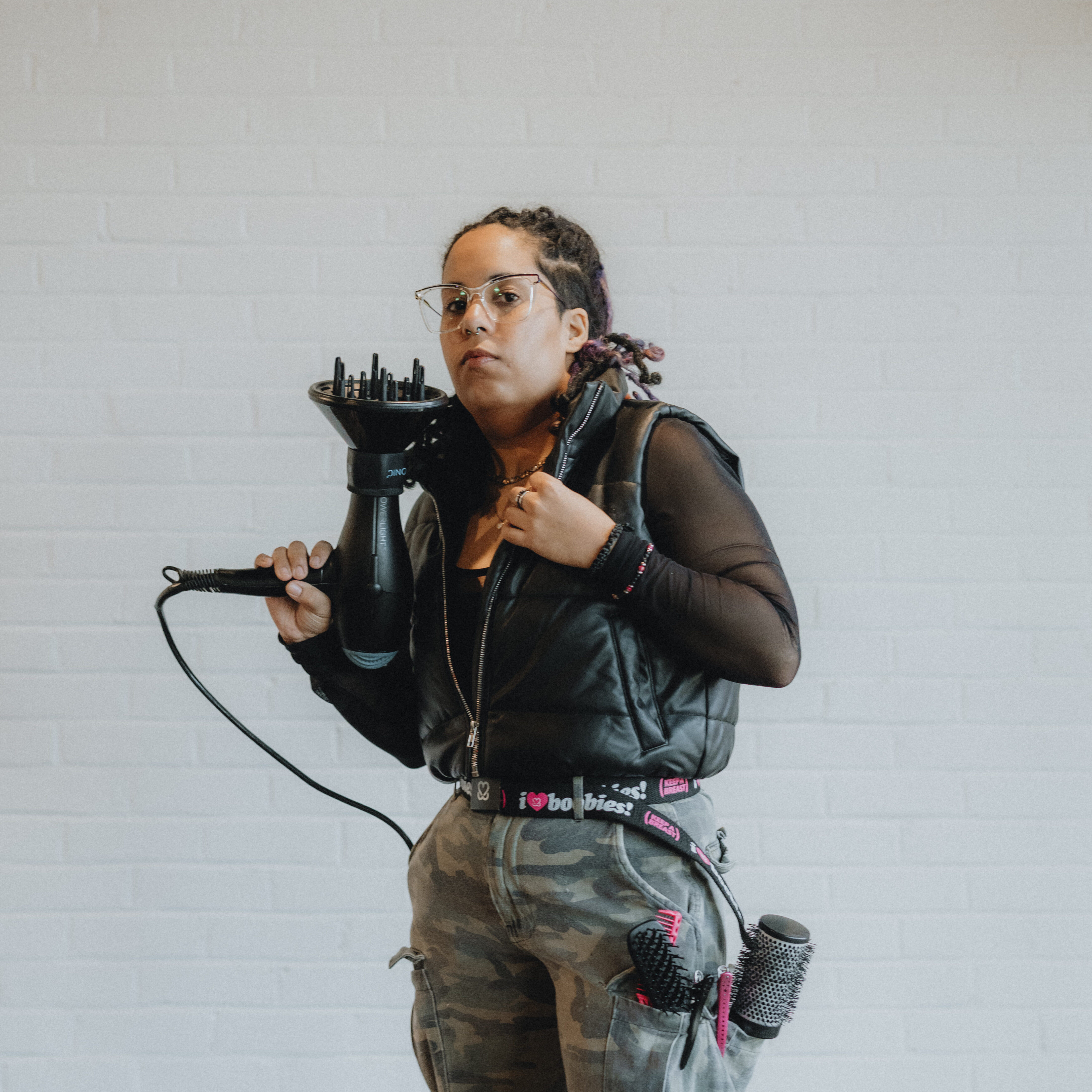 Rylan, stylist at Keenan Salon in Atlanta, specializing in blonding, blowouts, and polished, confidence-boosting styles.