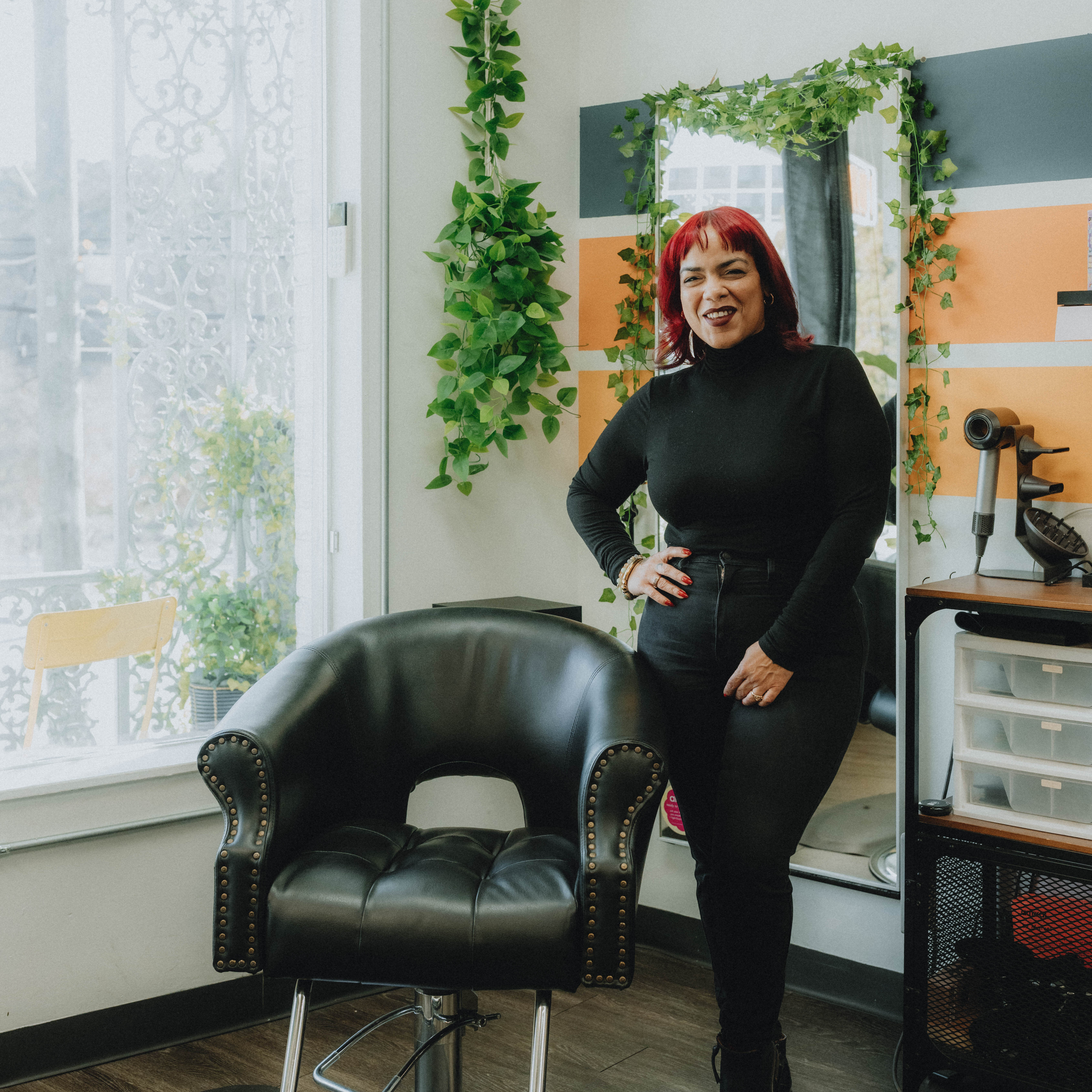 Luci, stylist at Keenan Salon in Atlanta, specializing in vivid haircolor and personalized color transformations.