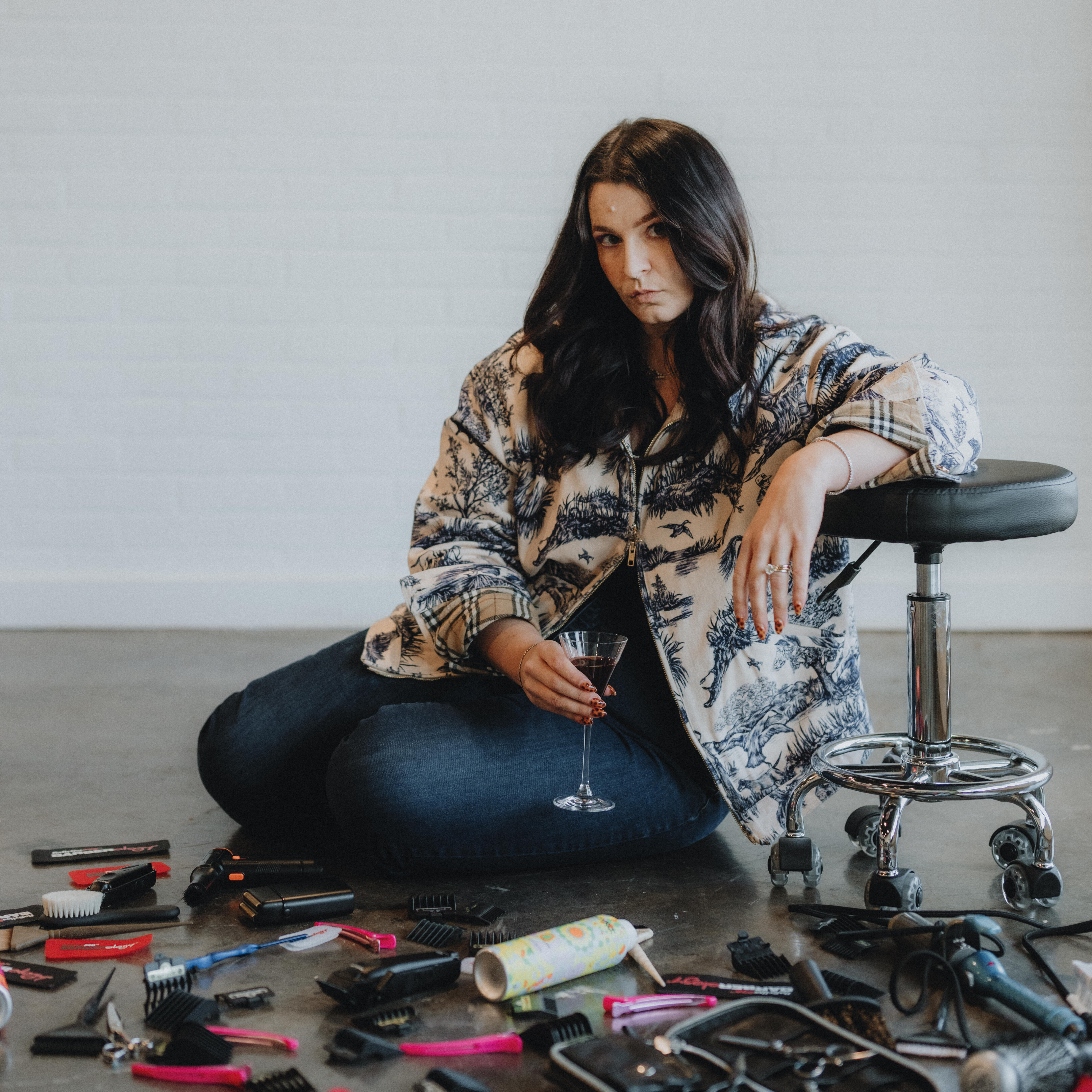 Kat, stylist at Keenan Salon in Atlanta, specializing in precision cuts, curly and textured hair, and gender-affirming haircuts.