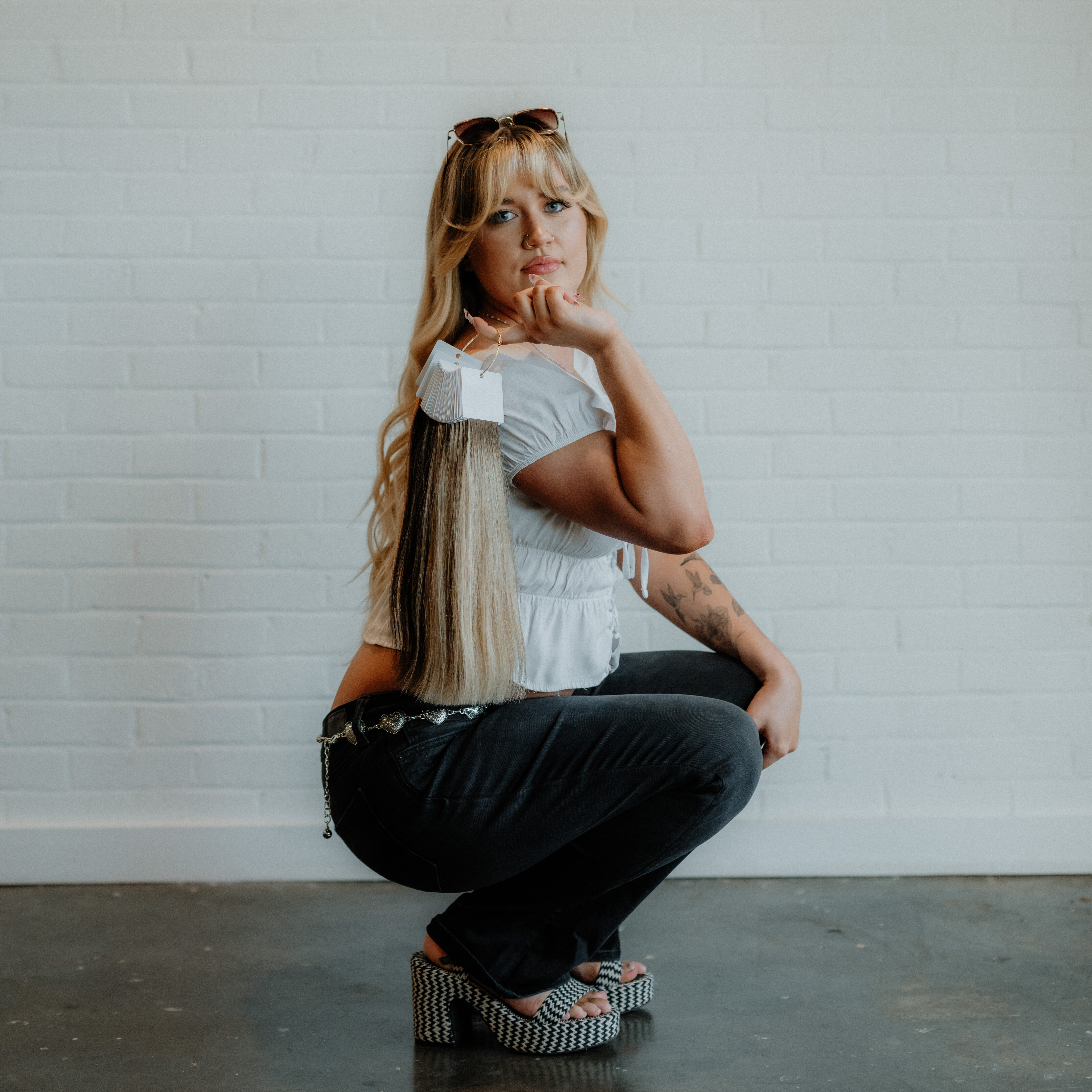 Madi, stylist at Keenan Salon in Atlanta, specializing in blonding, vivid color, and gender-affirming haircuts.