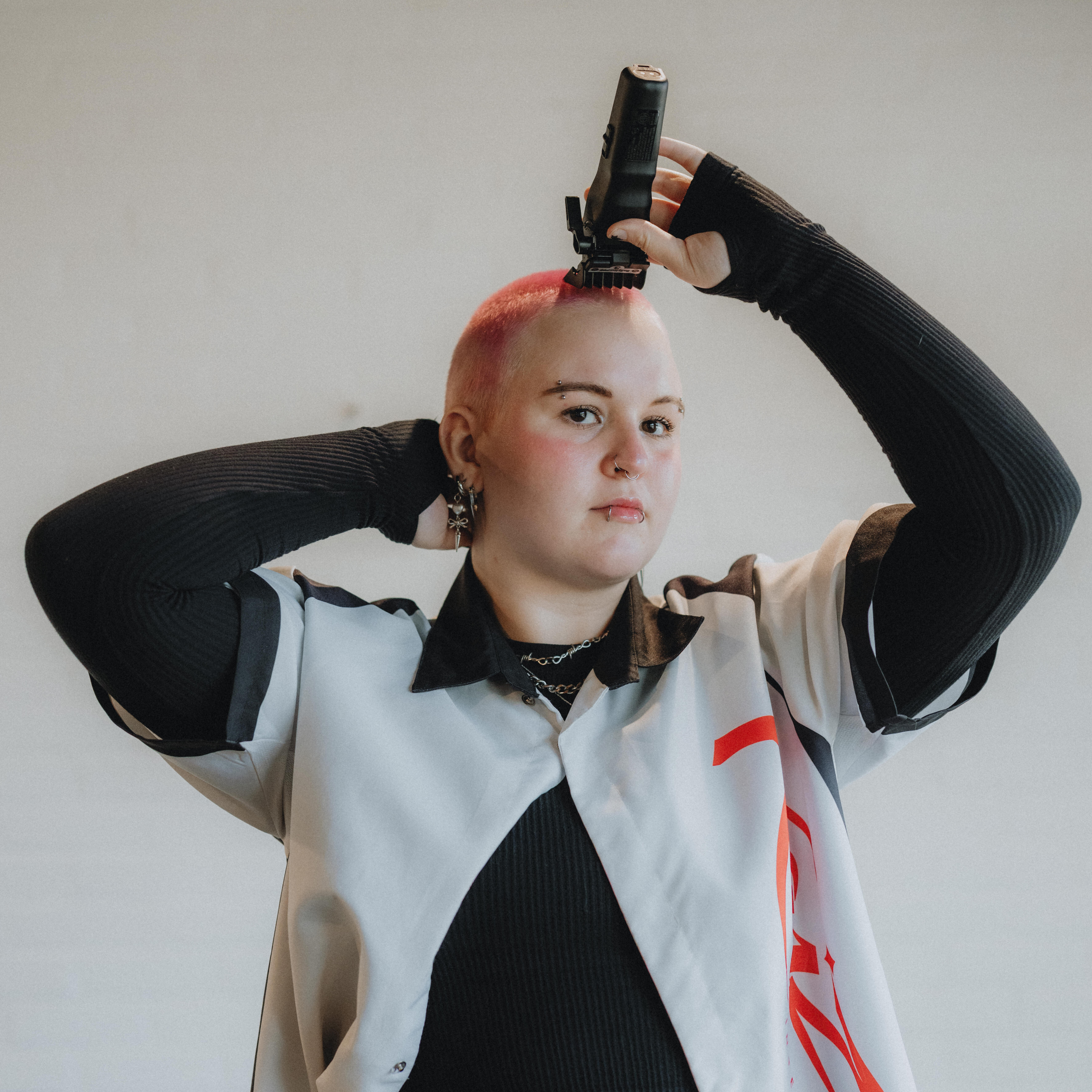 Luci, stylist at Keenan Salon in Atlanta, specializing in vivid haircolor and personalized color transformations.