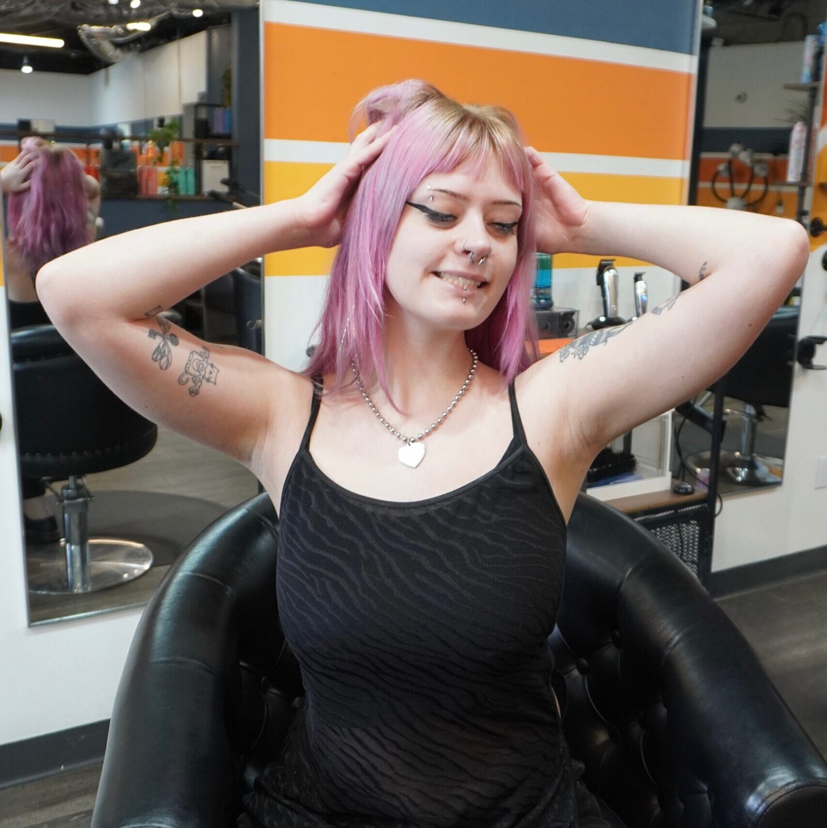 Luci, stylist at Keenan Salon in Atlanta, specializing in vivid haircolor and personalized color transformations.