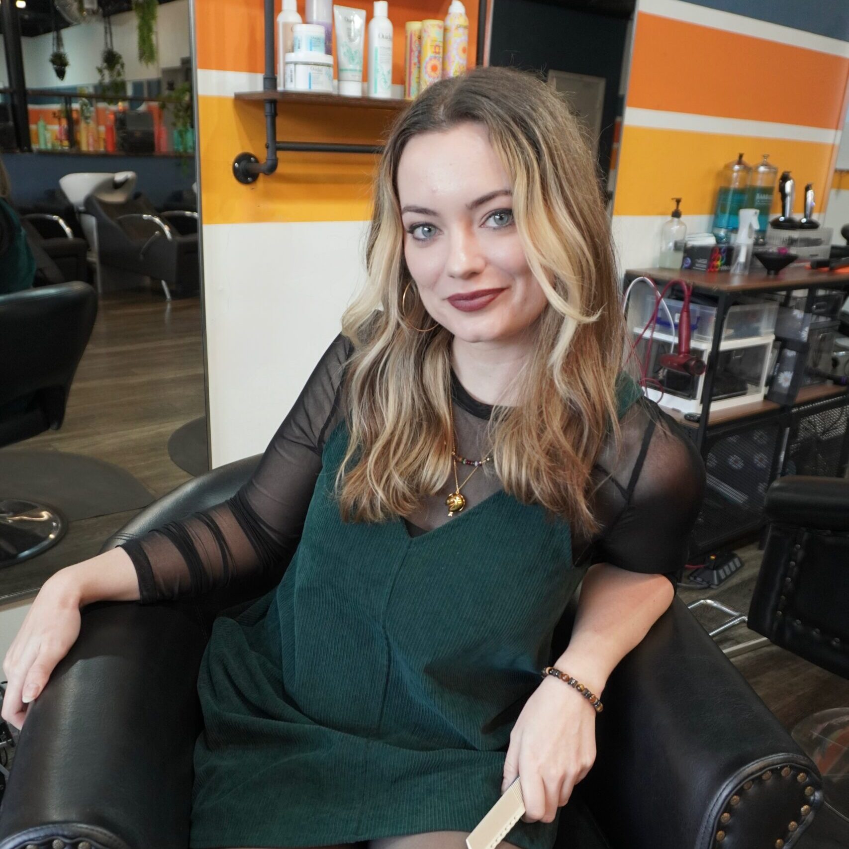 Luci, stylist at Keenan Salon in Atlanta, specializing in vivid haircolor and personalized color transformations.