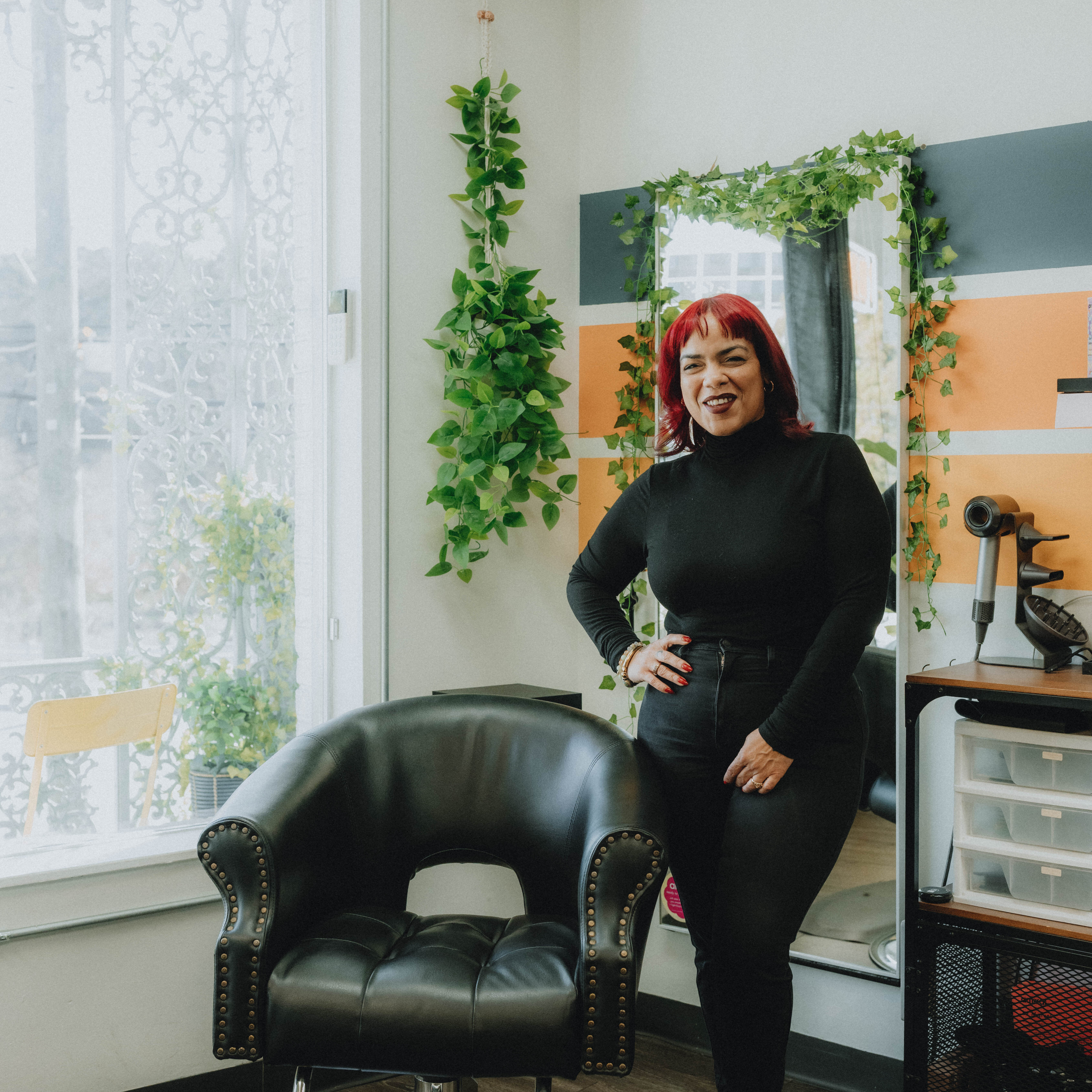 Luci, stylist at Keenan Salon in Atlanta, specializing in vivid haircolor and personalized color transformations.